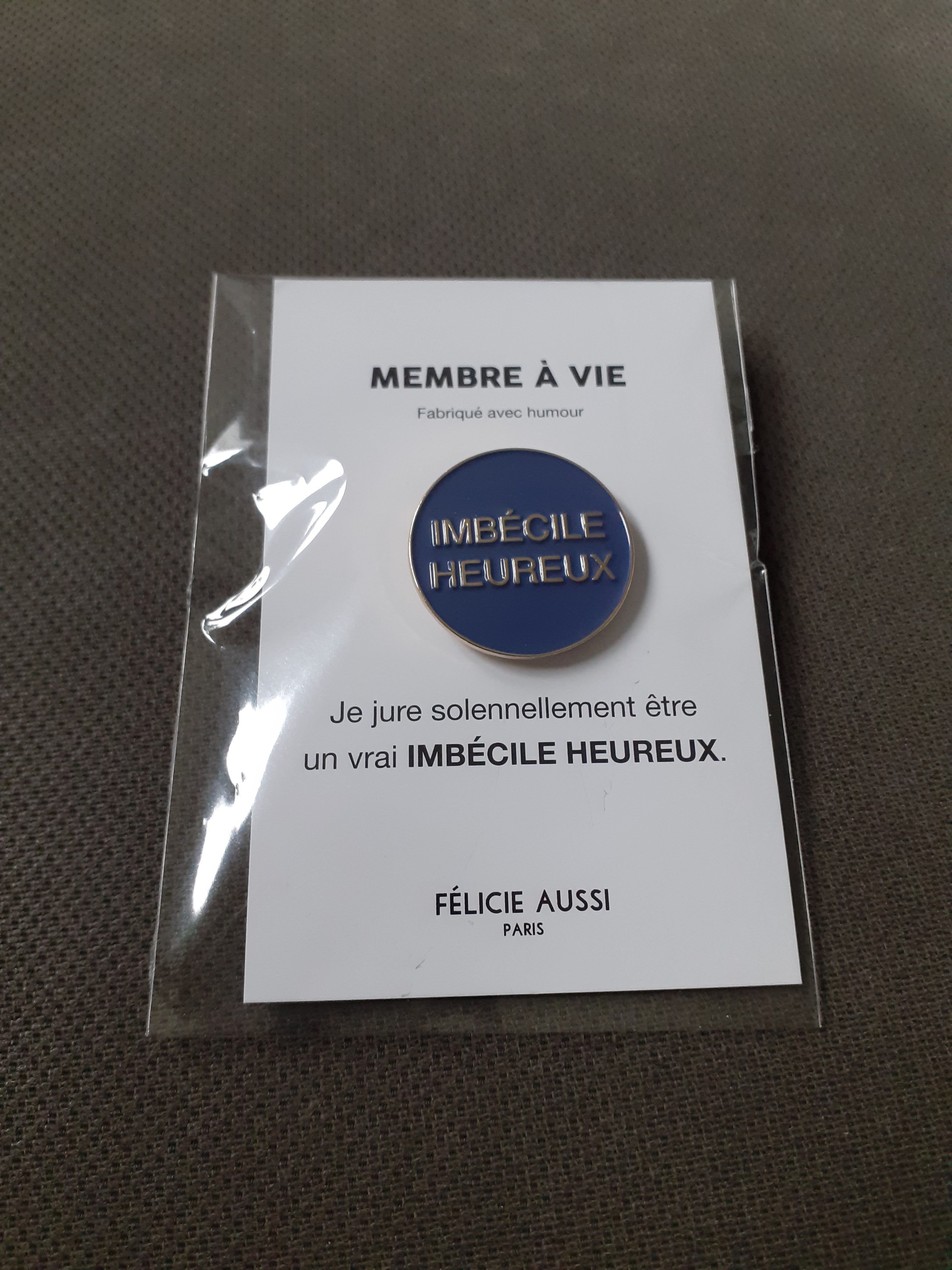 Pin’s – Imbécile Heureux - rond bleu marine